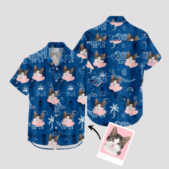 Blue Hawaiian shirt with dinosaur, cat face, and playful pattern