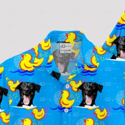 Blue Hawaiian shirt with black dog faces and yellow rubber ducks