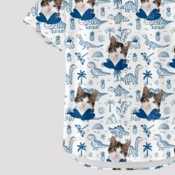 Cat face and dinosaurs on tropical Hawaiian shirt pattern
