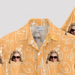 orange hawaiian shirt with sunglasses face and cocktail pattern