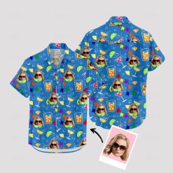 Blue Hawaiian shirt with cocktail glasses, faces, and party flags pattern