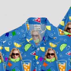 Blue Hawaiian shirt with cocktail glasses, faces, and party flags pattern