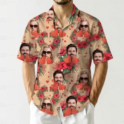Couples Hawaiian outfits with red hibiscus, green leaves, faces, and hearts on a sandy background