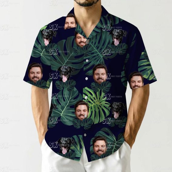 Dog on Hawaiian shirt with green tropical leaves and man's face pattern on dark background