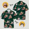A flamingo hawaiian shirt womens style with pink flamingos, cats, leaves, and water background