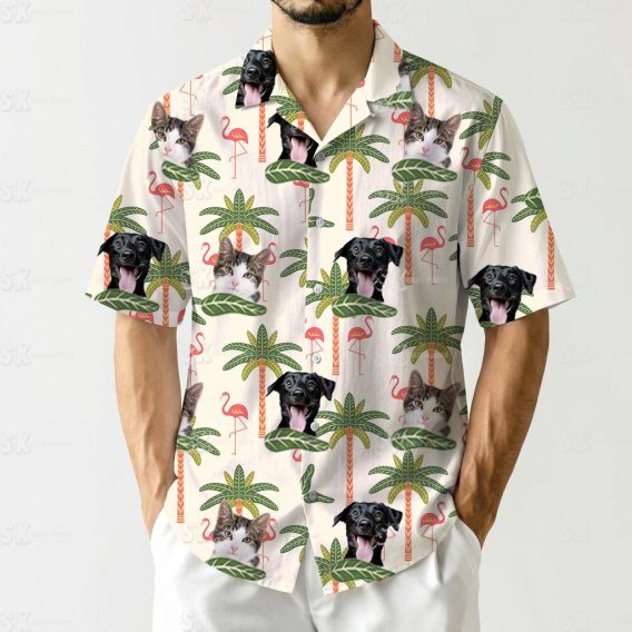 Flamingo tropical shirt featuring cats, dogs, palm trees, and green leaves in a playful design