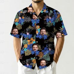 hawaiian shirt dog face design with tropical flowers, green leaves, and pineapples