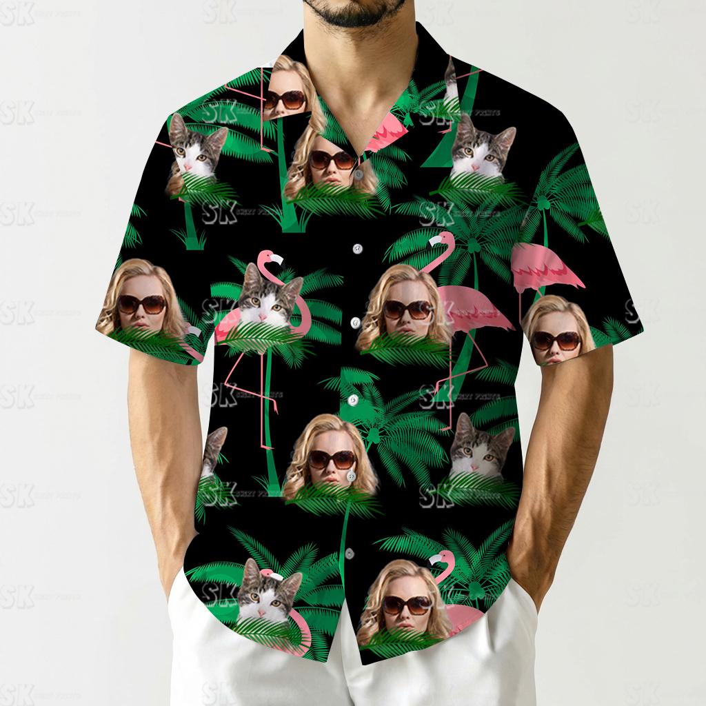 hawaiian shirt with pink flamingos, green palm leaves, cats, and faces on black