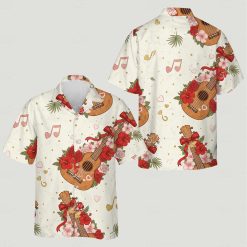 His and hers matching Hawaiian clothes featuring guitars, flowers, green leaves, musical notes and gold dots