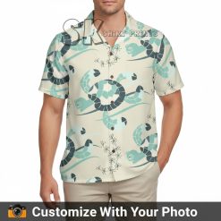 turtle hawaiian shirt with teal turtles and sea plants worn by man outdoors