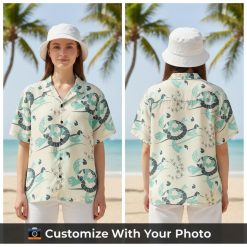 turtle hawaiian shirt with teal and gray turtles worn by woman at beach cafe
