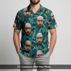 Hawaiian shirt with bearded face print and green leaves worn by man on beach