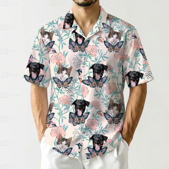 Hawaiian shirt shows black dog and cat faces with butterflies pink flowers design