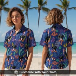 Woman wearing fun blue Hawaiian shirt with dog face, seahorses, and cartoon graphics