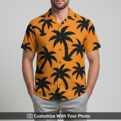 Man in tropical orange Hawaiian shirt with bold black palm tree print by Ralph Lauren