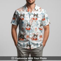 Man in custom cat Hawaiian shirt featuring dinosaurs, hearts, and palm tree patterns