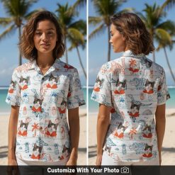 Woman wearing custom cat Hawaiian shirt with dinosaurs, hearts, and blue rainbows