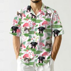Whimsical hawaiian shirt pattern showing repeated cats flamingos dogs tropical leaves flowers