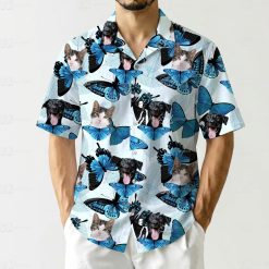 Fabric mens hawaiian cat shirt showing dog faces, cat faces, blue butterflies on light background