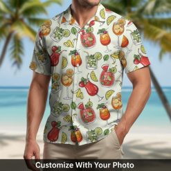 cocktail hawaiian shirt with lemons and drinks worn by man by the ocean