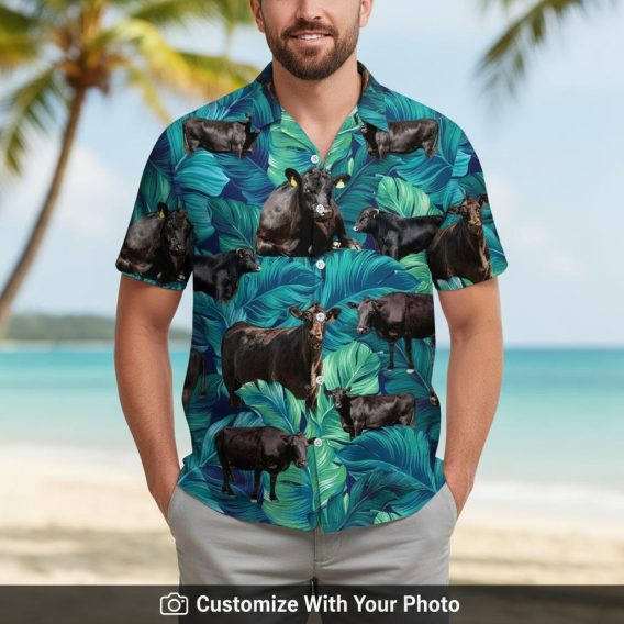 cow hawaiian shirt featuring black cows and green tropical leaves on man beachside