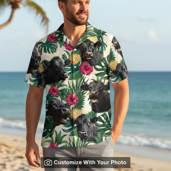 cow hawaiian shirt with pineapples and pink flowers worn by man outdoors