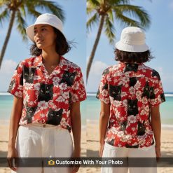 custom cat hawaiian shirt with black cat faces and hibiscus worn by woman beachside