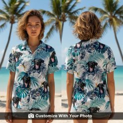 Woman wearing a custom dog Hawaiian shirt with black dog, teal leaves, orange flowers