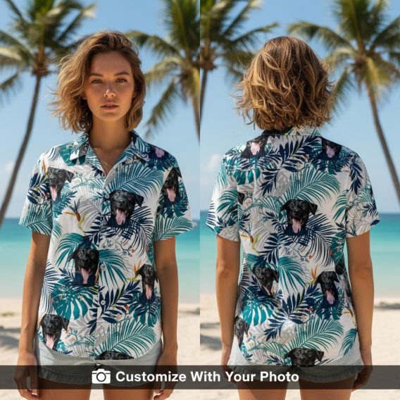 Woman wearing a custom dog Hawaiian shirt with black dog, teal leaves, orange flowers