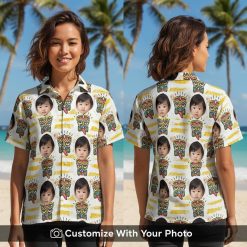 Hawaiian shirt with custom baby face print worn by woman, playful tribal patterns, beach sunset