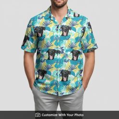 custom hawaiian dog shirt with tropical leaf and dog face print on man seaside