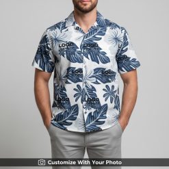 Man sporting custom Hawaiian shirt with personalized logo and bold leaf print