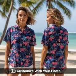 Woman wearing custom Hawaiian shirt with pink hibiscus and blue palm leaves