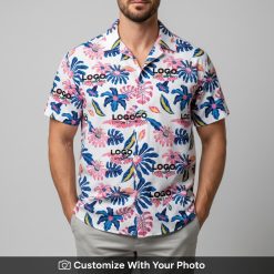 Man in custom aloha shirt featuring pink hibiscus and blue tropical Monstera leaves