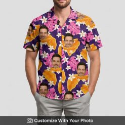 Man in personalized Hawaiian shirt featuring colorful face and tropical leaves design