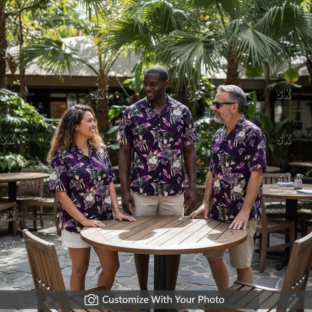 Group wearing matching black cat hawaiian shirt seated at outdoor tropical restaurant patio