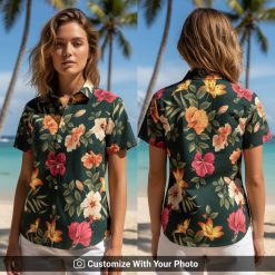 Woman wearing Hawaiian floral shirt with red hibiscus and lilies outdoors