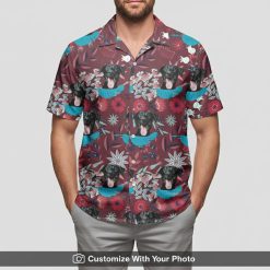 hawaiian shirt with dog print maroon florals worn by man at beach
