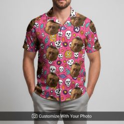 Hawaiian shirt with monkey face print worn by man during golden beach sunset