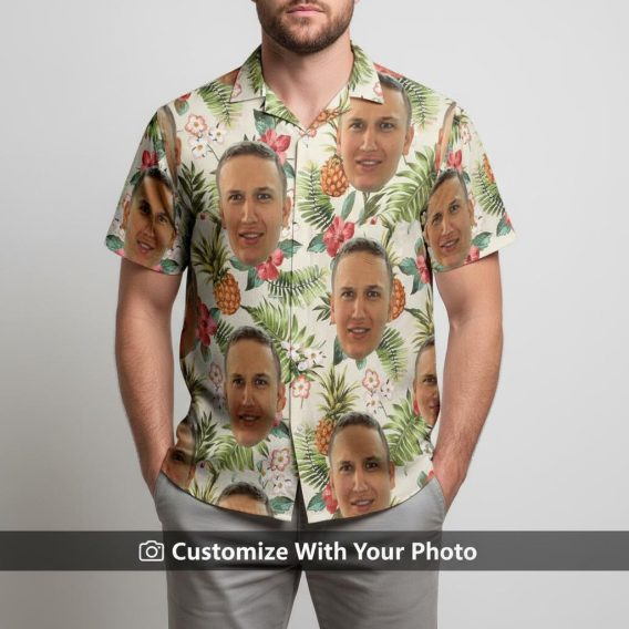 Hawaiian shirt with dog face print worn by man with pineapples at seaside
