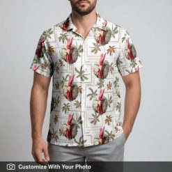 Hawaiian shirt with rooster face print worn by man with palm leaves sunset