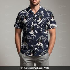 Man in T Rex Hawaiian shirt featuring black dog and white skeletons on blue