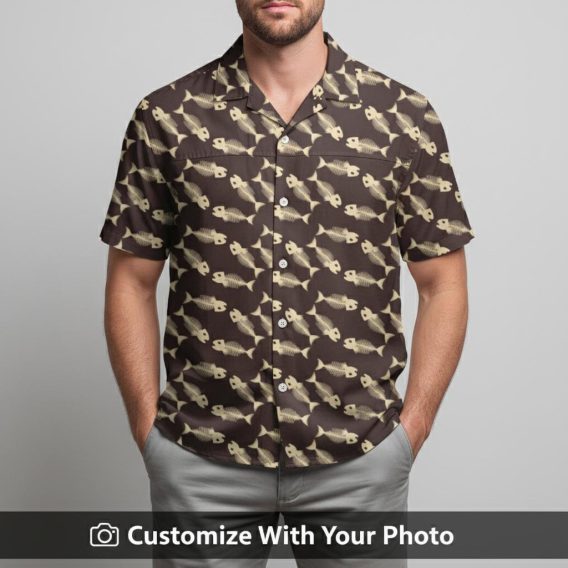 Man in tropical fish Hawaiian shirt with repeating beige and brown fish motifs