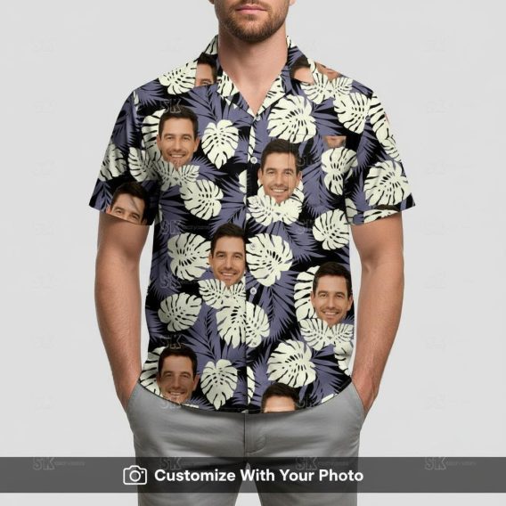 Man in black custom face Hawaiian shirt with dark blue and cream monstera leaves