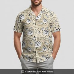 Man in fish print hawaiian shirt featuring bold black and white fish designs