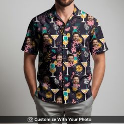 Man wearing black Hawaiian shirt with pink, teal, and yellow tropical face print