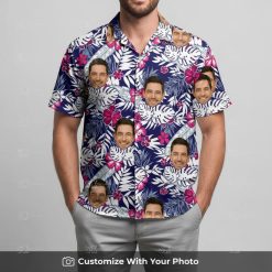 Man in custom face floral Hawaiian shirt with navy blue and white monstera leaves