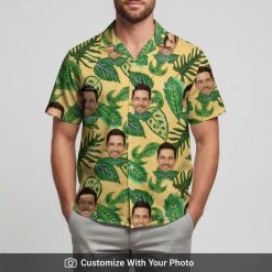 Man in custom Hawaiian shirt with repeated face and tropical leaf pattern outside