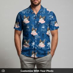 Man in dinosaur print Hawaiian shirt with cat face and palm tree doodles on blue background