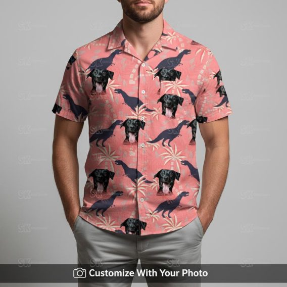 Man in pink dinosaur aloha shirt with black dog face and tropical palm tree print